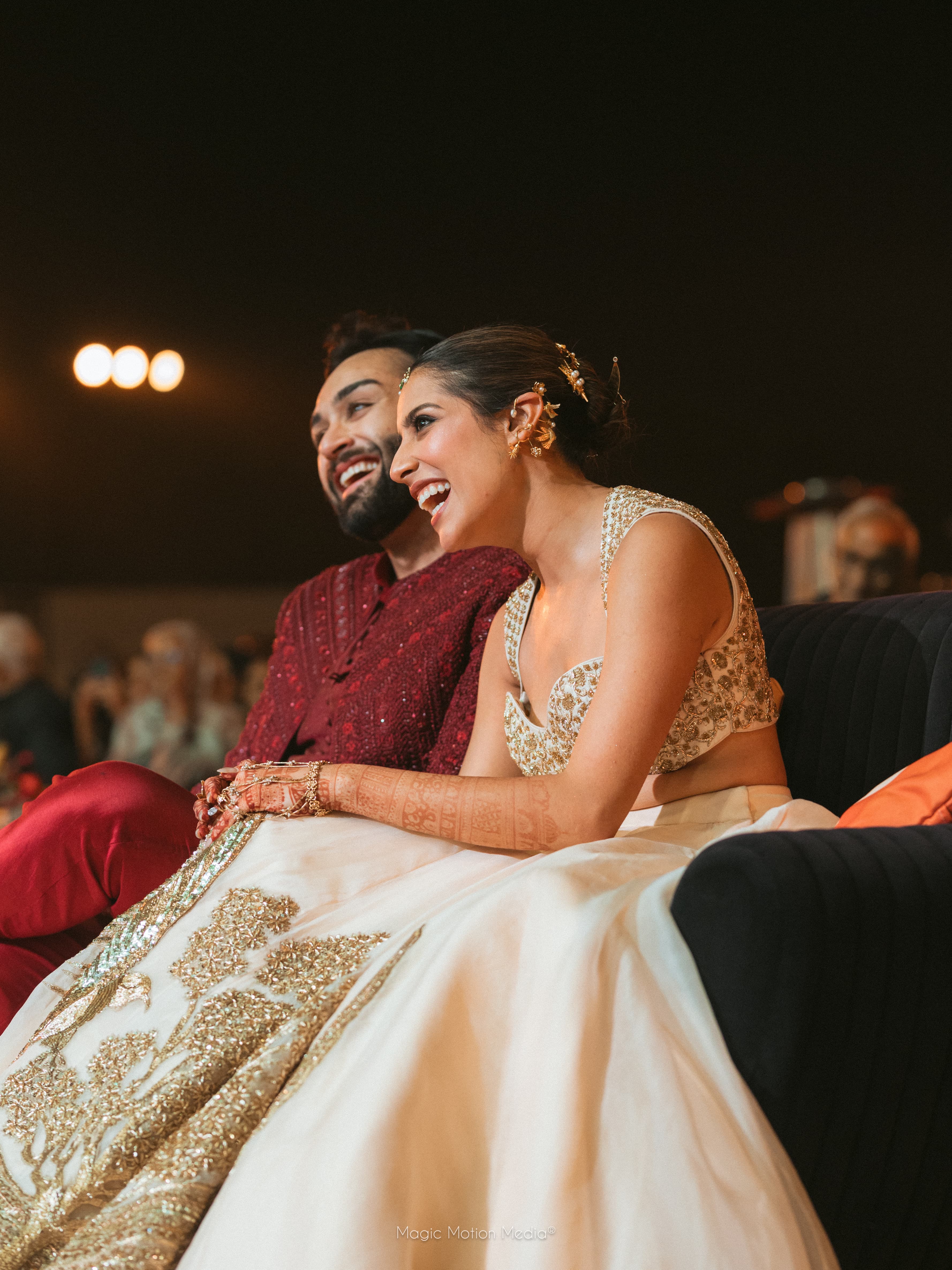 Candid laughing couple in wedding attire