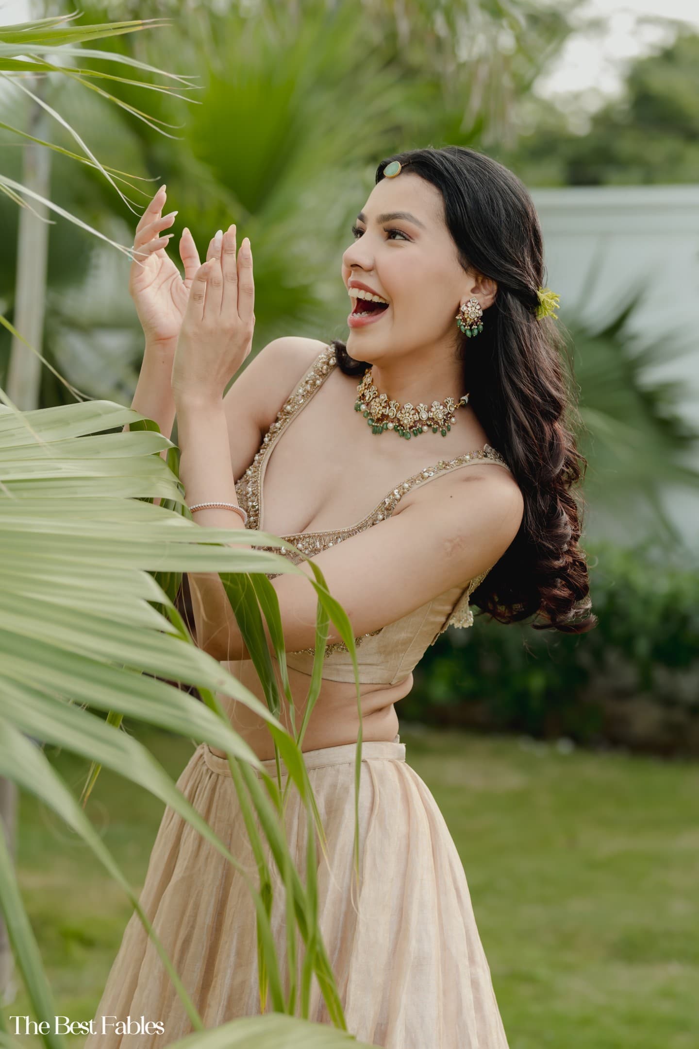 Festive champagne lehenga styled in a garden